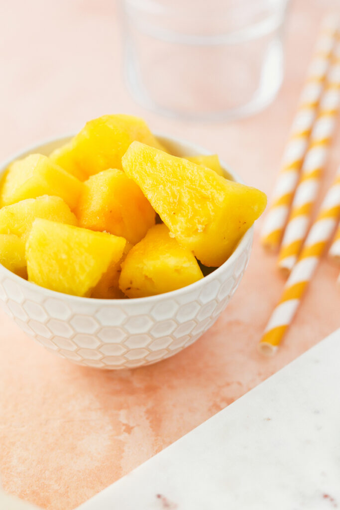 white bowl with fresh pineapple chunks