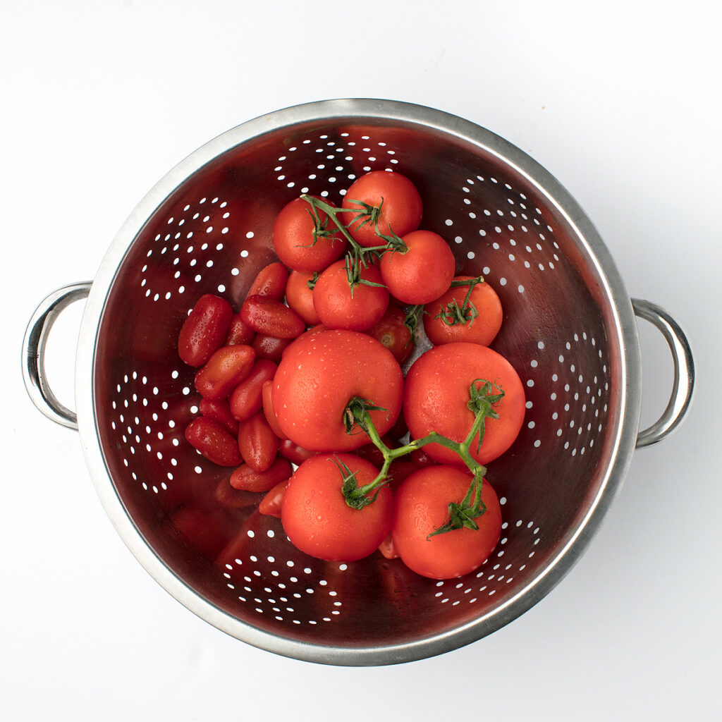 washed tomatoes in a colander